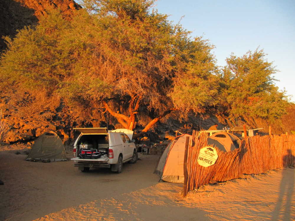 camp setting in ugab river rhino camp at sunset - Dusty Trails Safaris Namibia & Dusty Car Hire Namibia