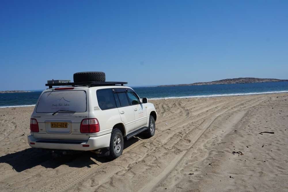 "Tom Cruiser" - the 100series Land Cruiser at Agate Beach near Lüderitz - Dusty Trails Safaris Namibia & Dusty Car Hire Namibia