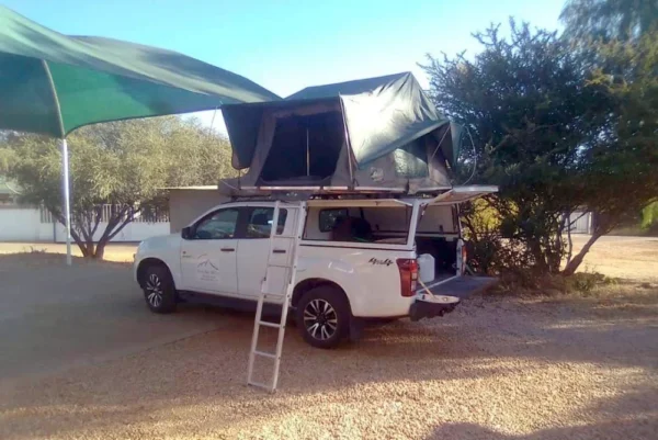 camping double cab with rooftop tent - showing tent entry